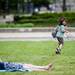 Ann Arbor resident Raymond Kangas, 6, runs on grass with friends while girls take pictures on a blanket on Friday, June 21. Daniel Brenner I AnnArbor.com